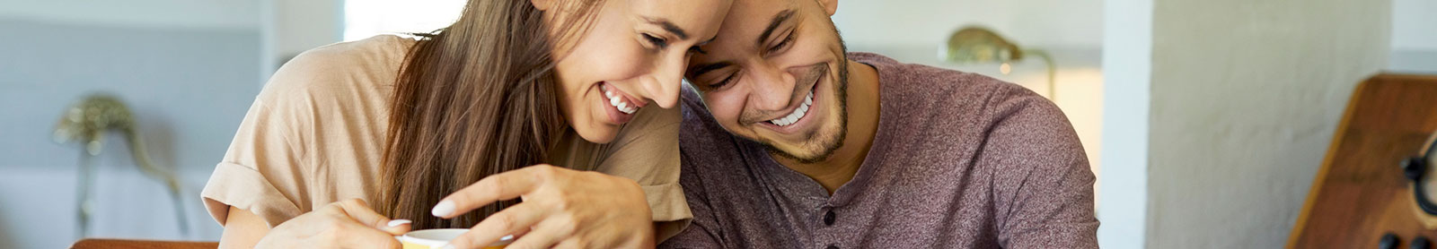 Young couple sitting in living room